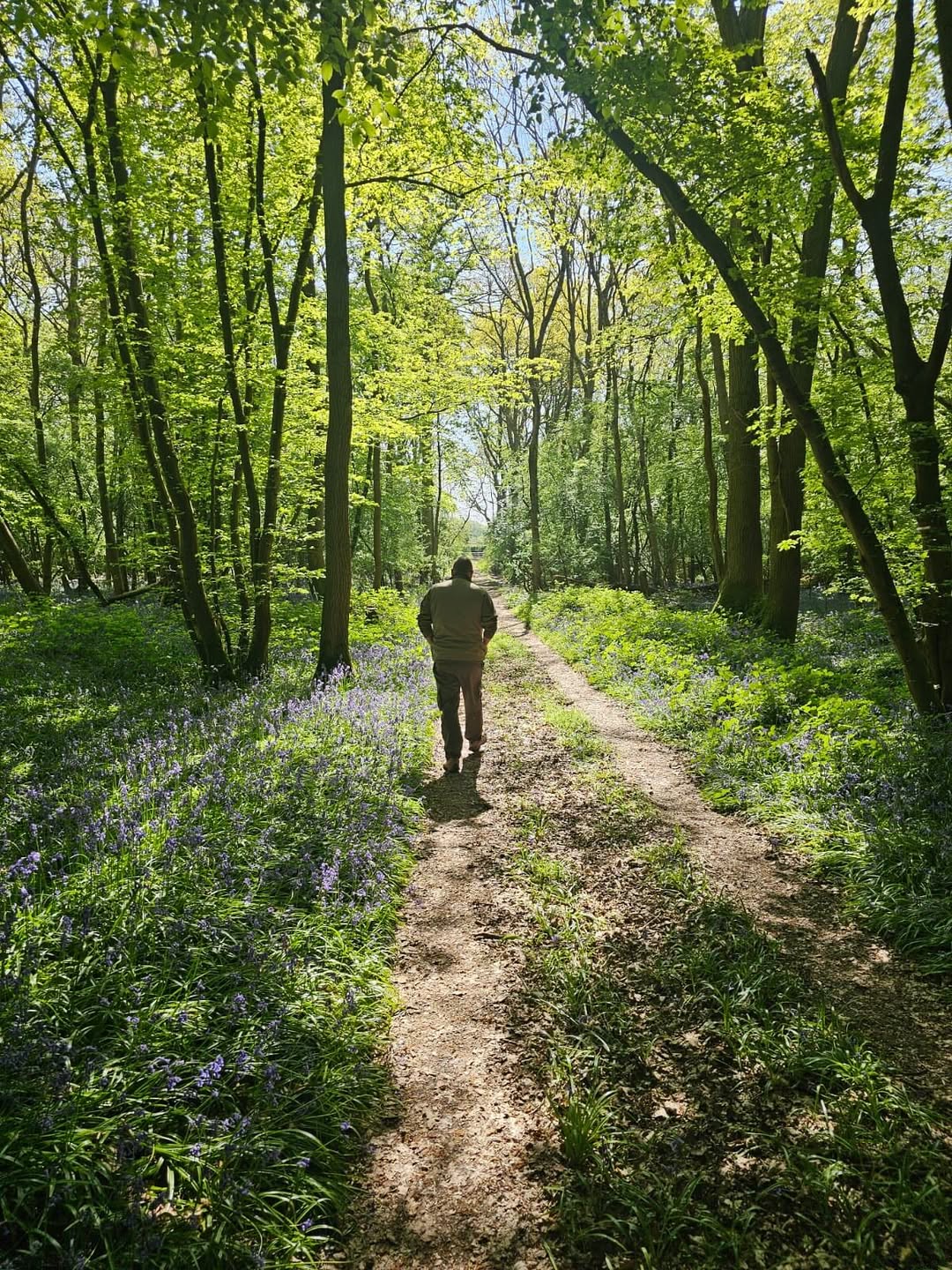 Paul with camping gear in the woods